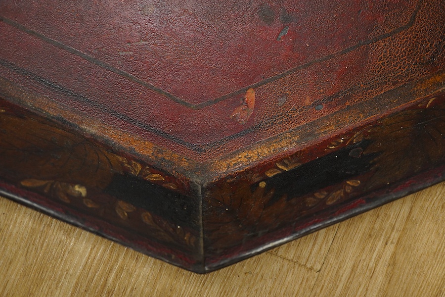 An early 19th century octagonal red painted toleware tray, possibly Pontypool, 66cm wide. Condition - poor